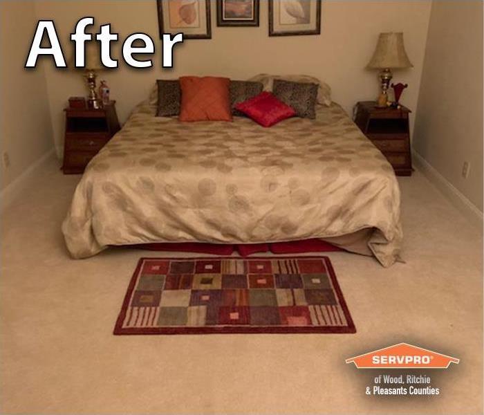 A parkersburg bedroom in a finished basement that has been fixed from water and sewer damage it is now clean